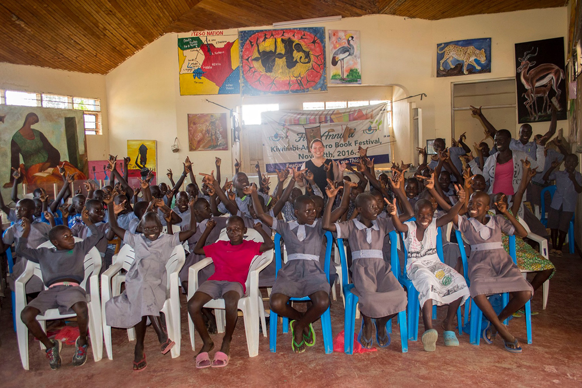 Graduate students interacting with students during their international trip