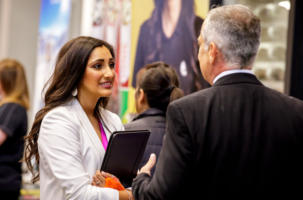 Student smiling in a conversation