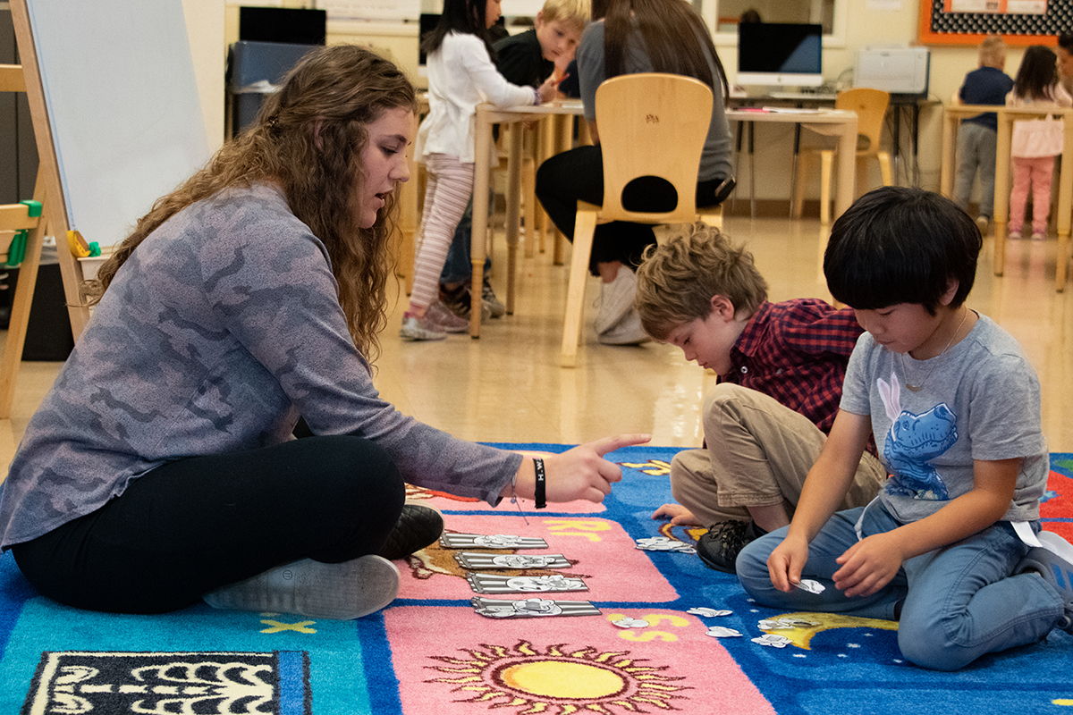 Teacher and students in a child care environment