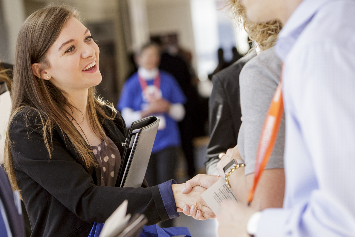 MSET Student shaking hands at a career fair. MSET Student shaking hands at a career fair.